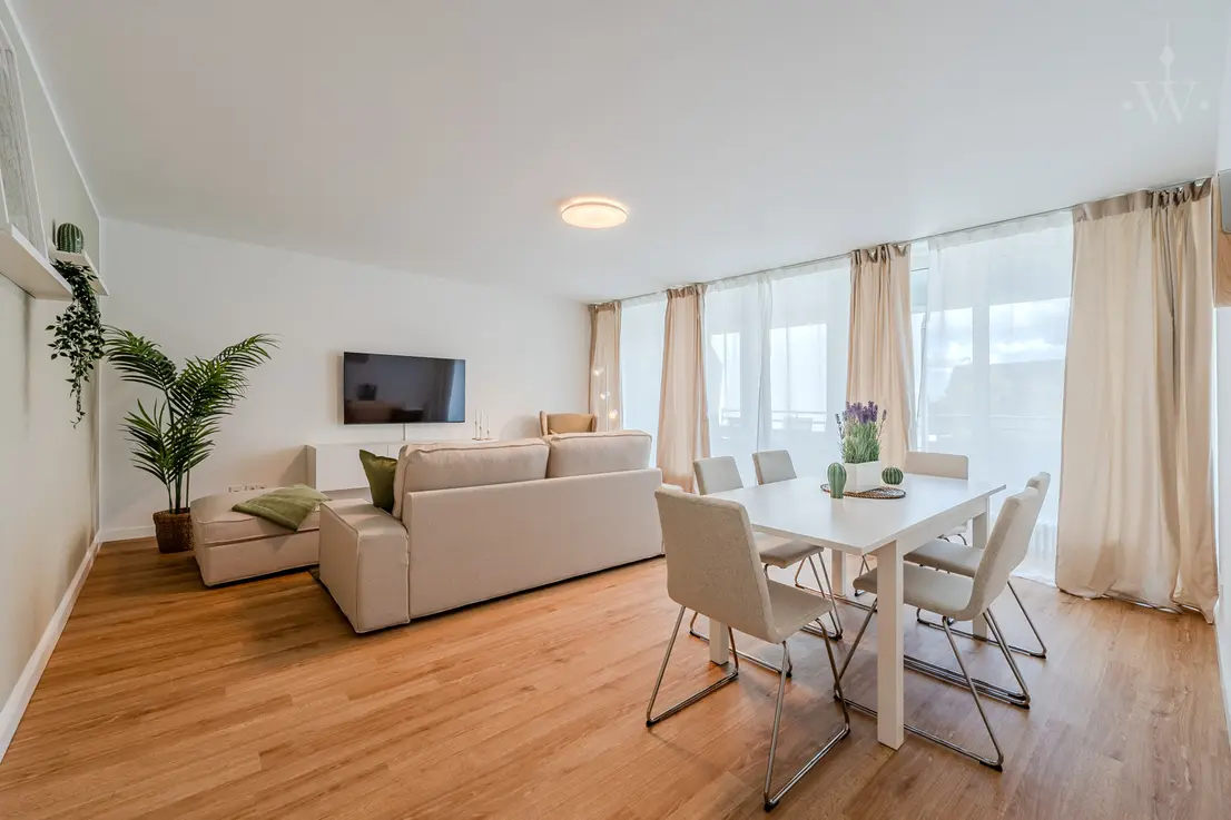 Living room with 2 large windows and dining table