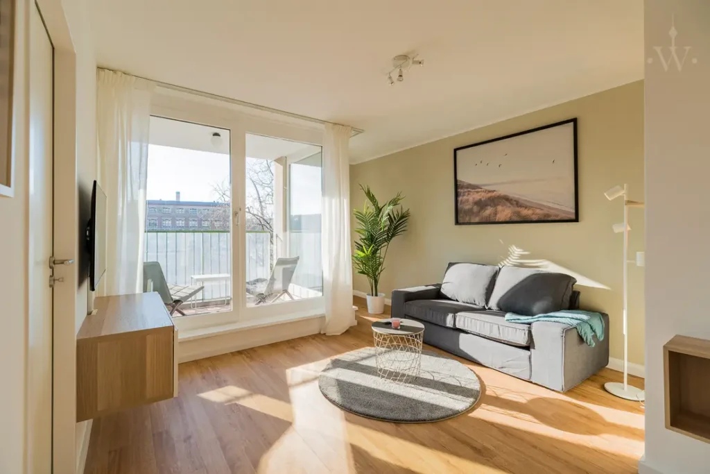 Sofa with a large balcony door and carpet