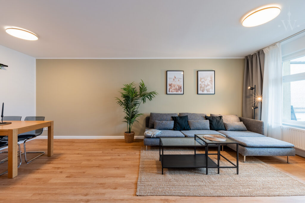Couch with carpet and dining table