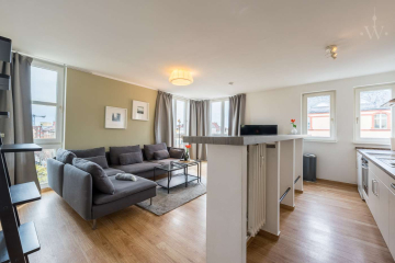 Wohnzimmer - Modern möblierte 2-Zimmer-Wohnung mit Blick über Berlin Schöneberg